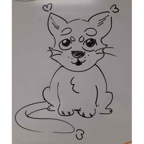 Black whiteboard pen drawing of the cat in the artist's style. It has heart-shaped tufts at the end of its ears and tail, and a fuzzy chest.